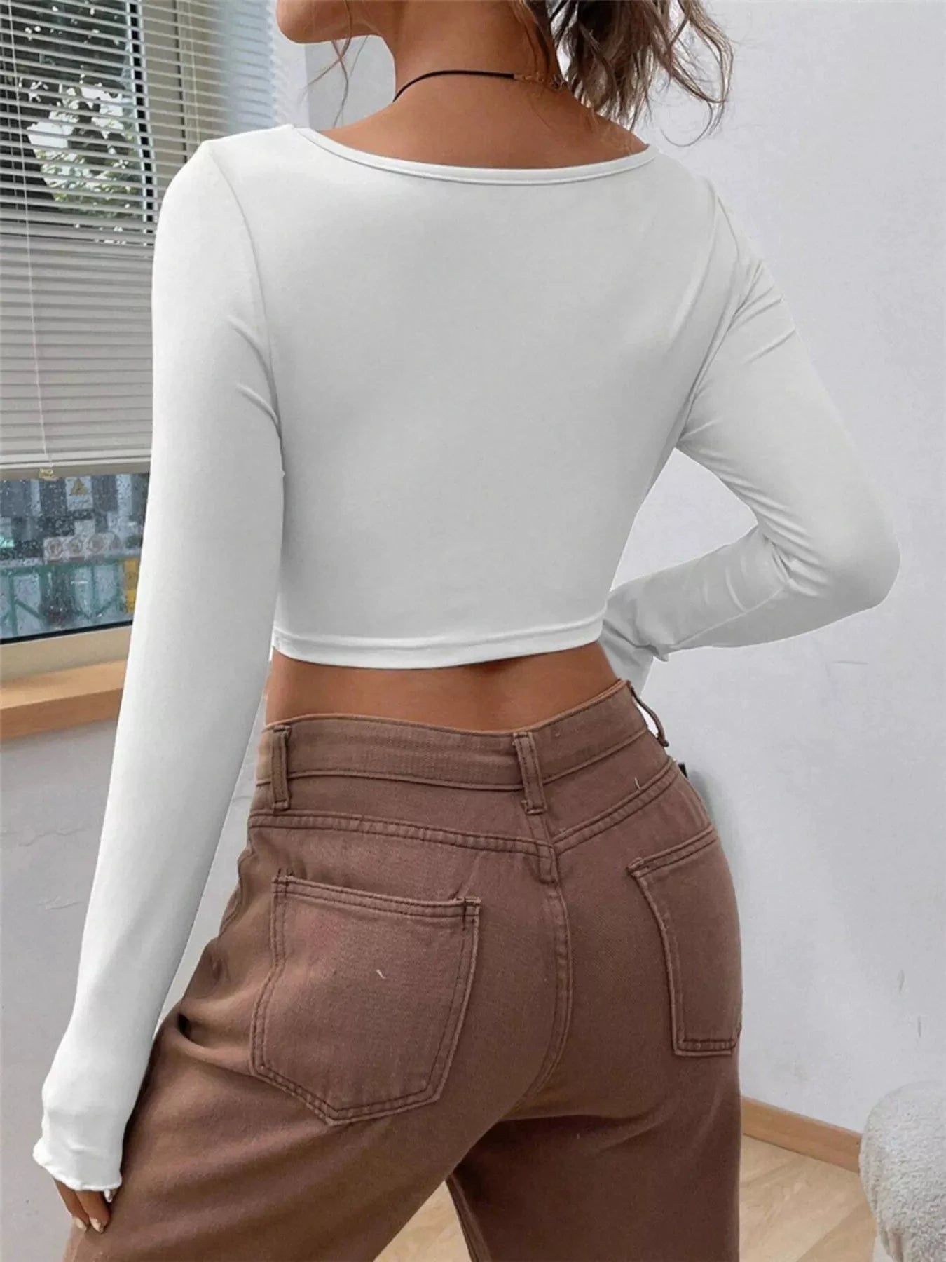 Twisted Front Long Sleeve T-Shirt by Trendsi