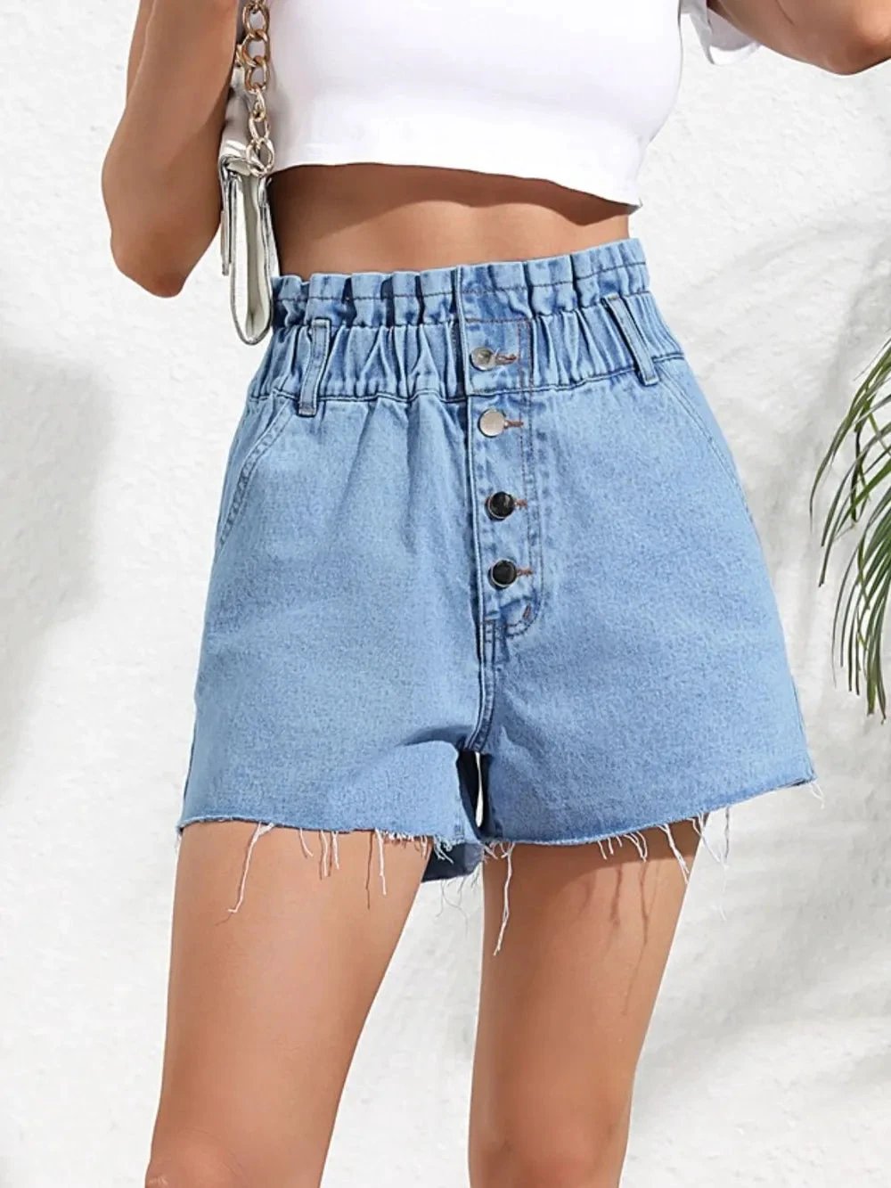 Fashionable high waisted loose and slimming denim shorts with frayed edges by eprolo