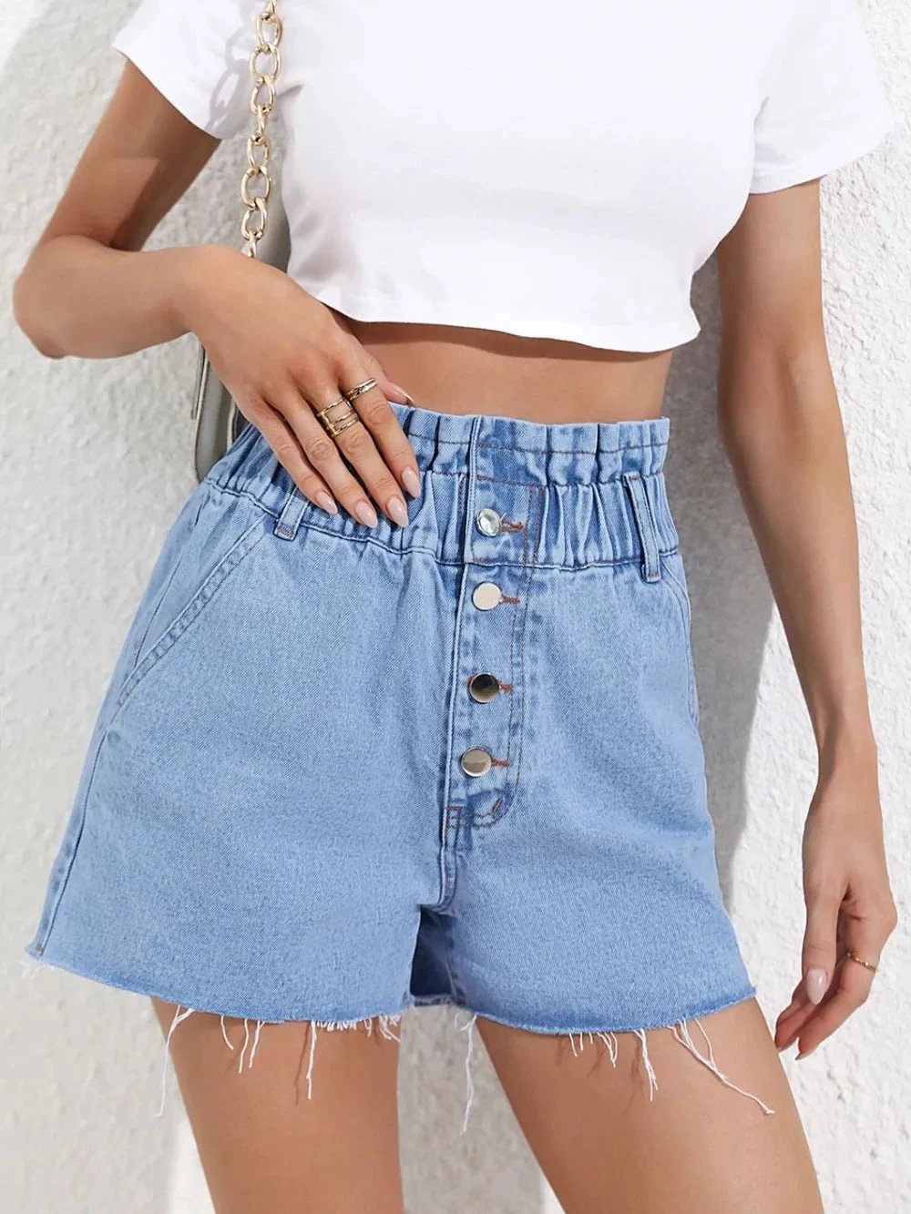 Fashionable high waisted loose and slimming denim shorts with frayed edges by eprolo