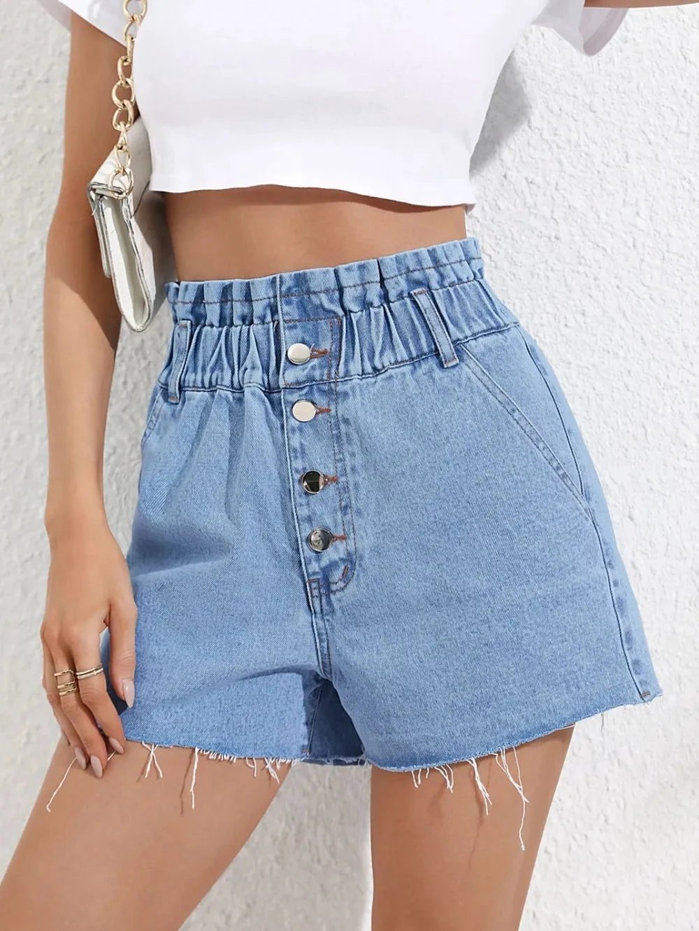 Fashionable high waisted loose and slimming denim shorts with frayed edges by eprolo