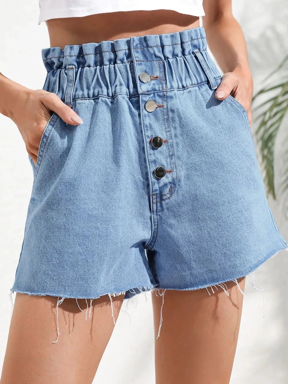 Fashionable high waisted loose and slimming denim shorts with frayed edges by eprolo