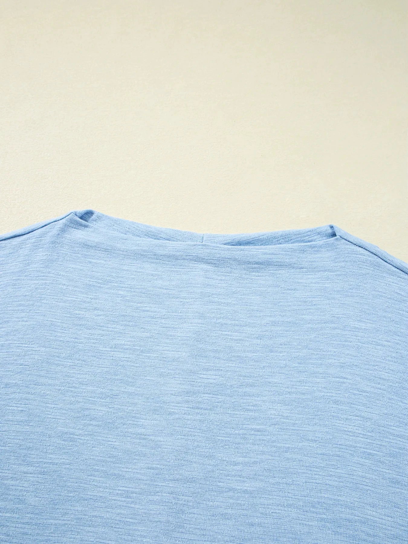 Solid Color Batwing Long Sleeve Top by Trendsi