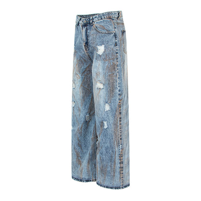 Pantalon en denim délavé, coupe droite oversize.