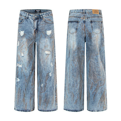 Pantalon en denim délavé, coupe droite oversize.