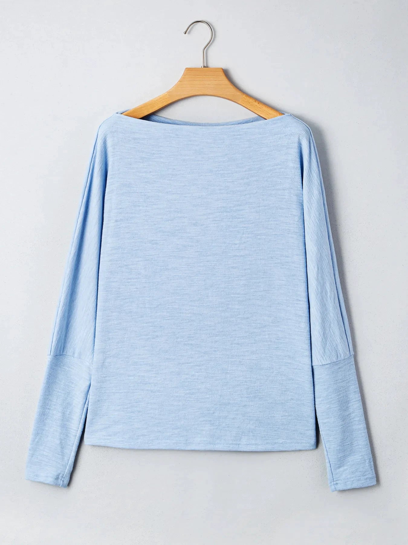 Solid Color Batwing Long Sleeve Top by Trendsi